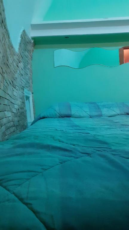 Säng eller sängar i ett rum på Casa Vacanze VIESTE