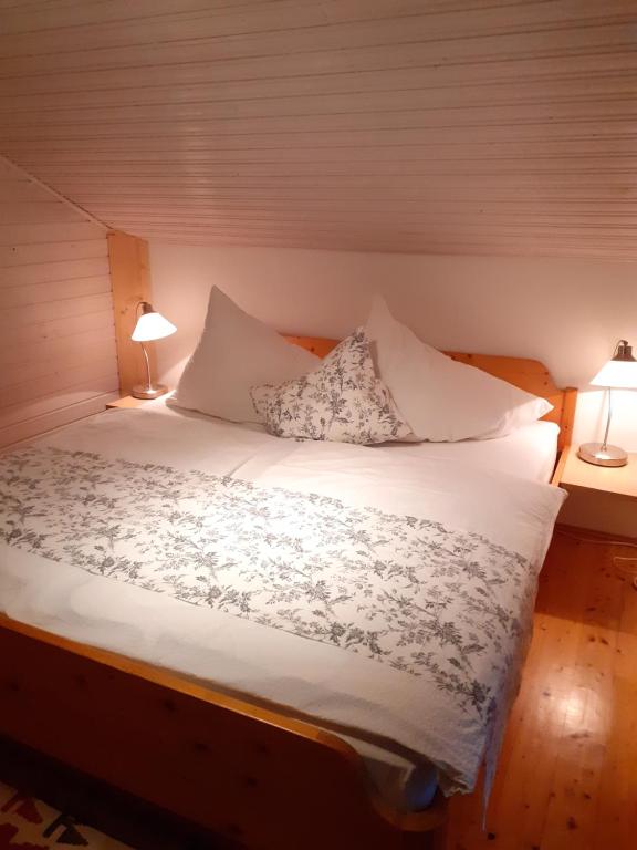 Postel nebo postele na pokoji v ubytování Apartmenthaus AMELIE