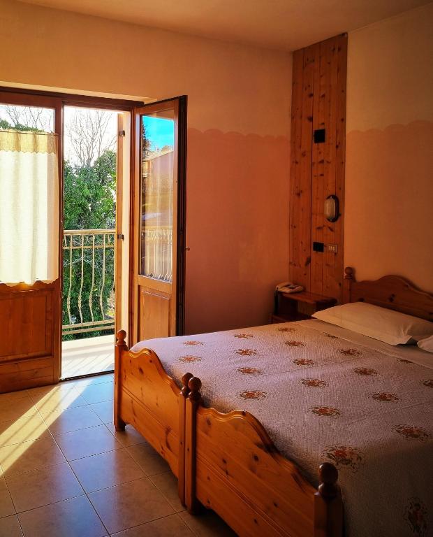 Postel nebo postele na pokoji v ubytování Hotel Piccola Mantova