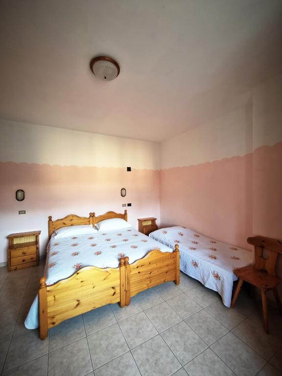 Postel nebo postele na pokoji v ubytování Hotel Piccola Mantova
