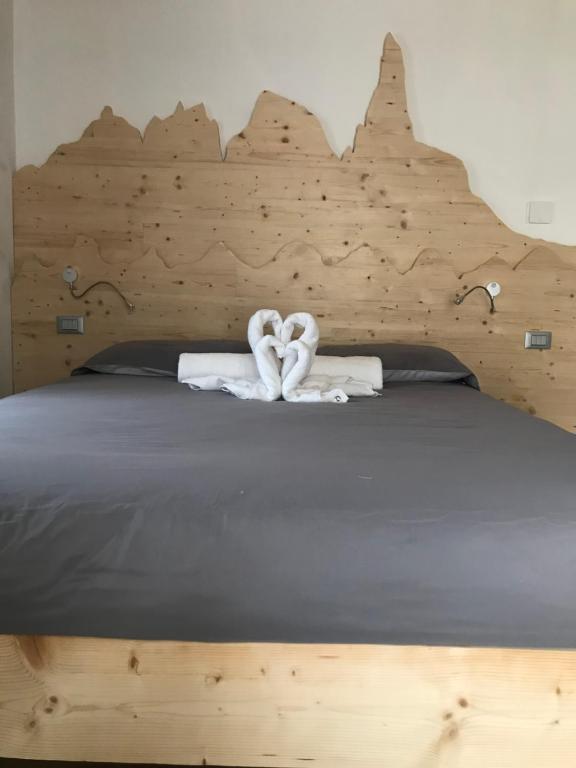Posteľ alebo postele v izbe v ubytovaní Appartamento Profumo di Legno 022139-AT-010022