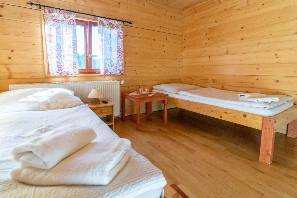 Postel nebo postele na pokoji v ubytování Penzión Javorina