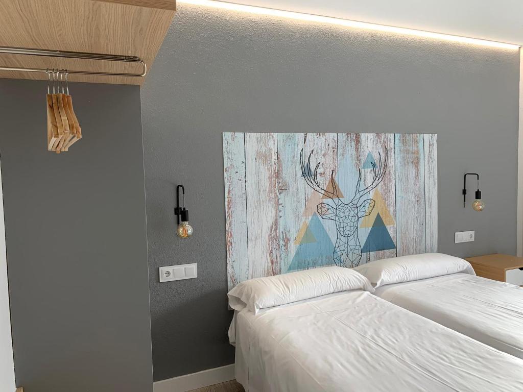 Postel nebo postele na pokoji v ubytování Ciudad de Jaca