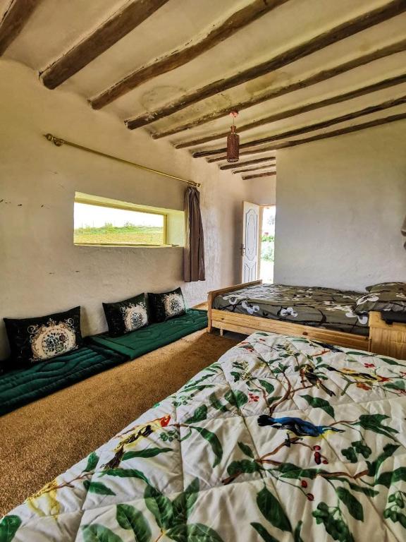 Postel nebo postele na pokoji v ubytování La Belle Etoile