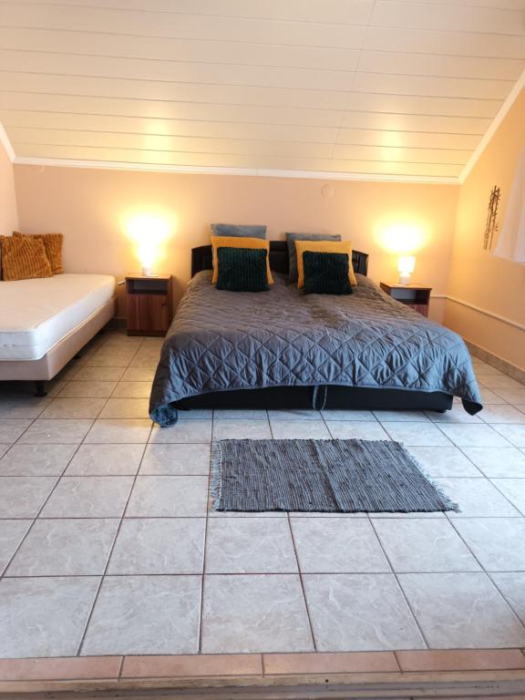 Posteľ alebo postele v izbe v ubytovaní Miranda Apartmanház