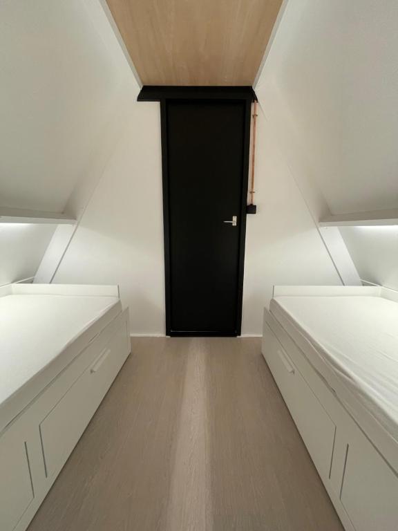 Postel nebo postele na pokoji v ubytování Sunclass Durbuy huisje 205