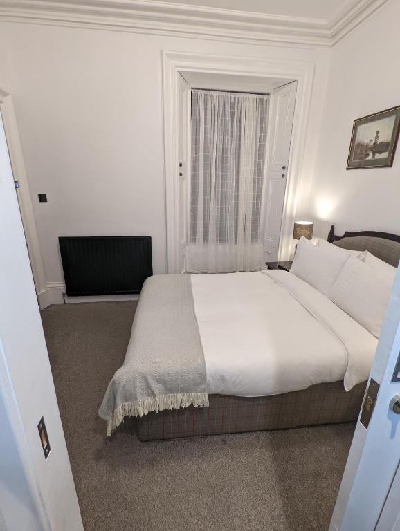 Postel nebo postele na pokoji v ubytování Cambeth Lodge