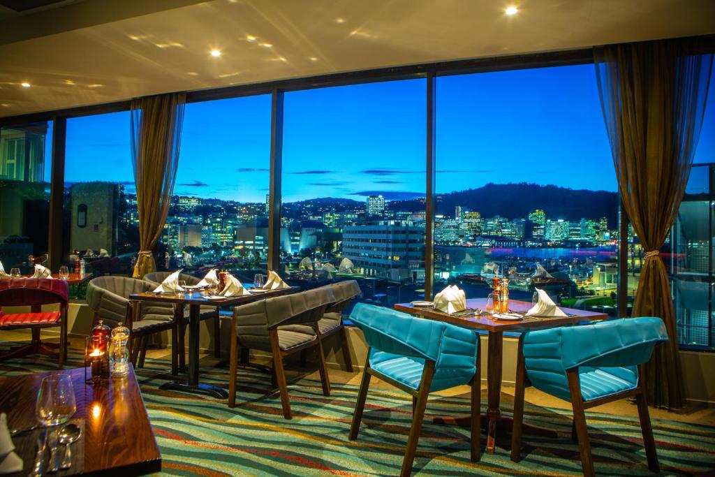 a dining room filled with tables and chairs at Copthorne Hotel Wellington, Oriental Bay in Wellington