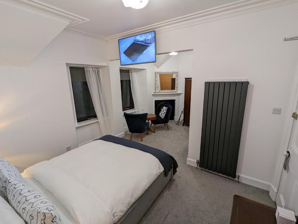 Postel nebo postele na pokoji v ubytování Cambeth Lodge