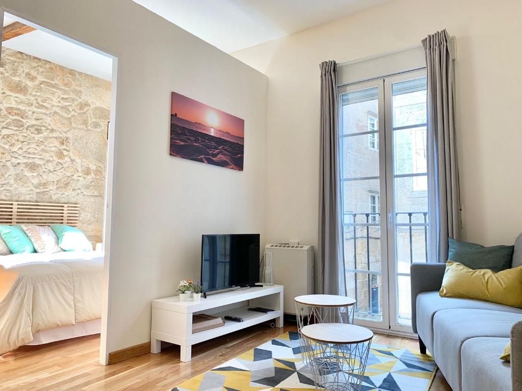 Televízia a/alebo spoločenská miestnosť v ubytovaní Precioso apartamento en el Casco Vello de Vigo