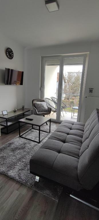 a living room with a couch and a coffee table at Perfect Place 33 in Varaždin