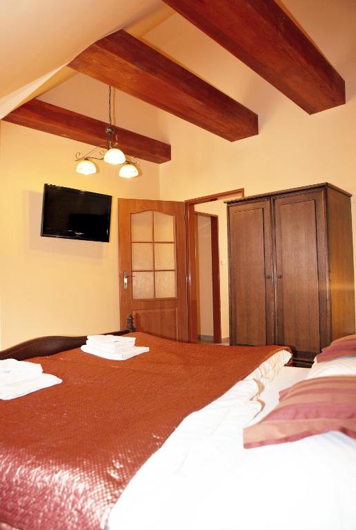 Postel nebo postele na pokoji v ubytování Hotel Pelikán