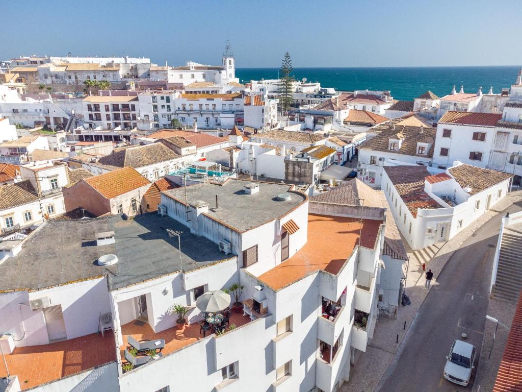 an aerial view of a city with buildings and the ocean at Lena`s Beach House by HelloVacations in Albufeira