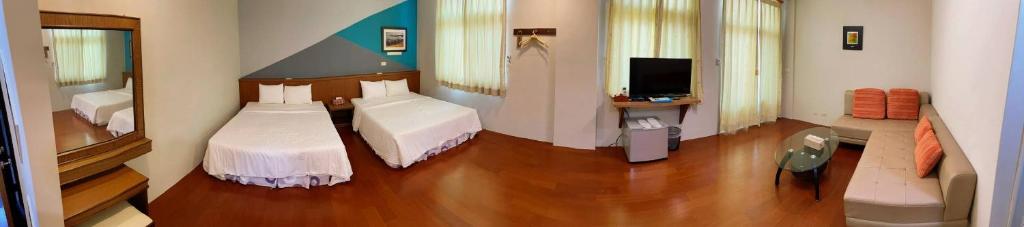 Postel nebo postele na pokoji v ubytování Coast Shan Shui B&B