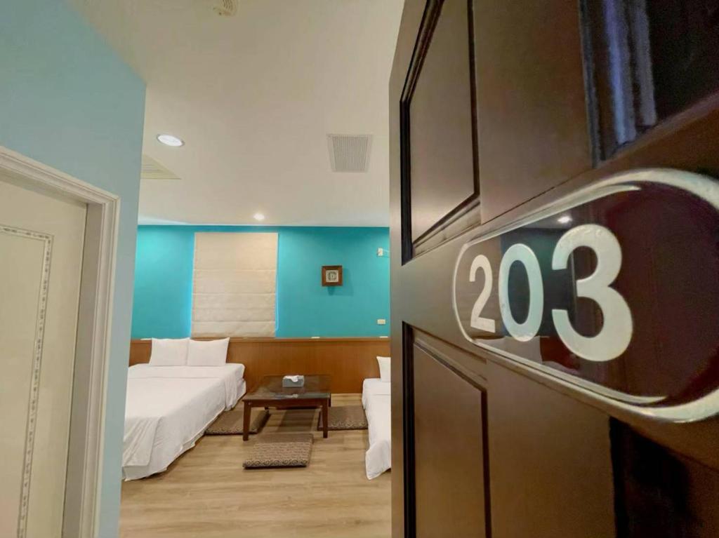 Postel nebo postele na pokoji v ubytování Coast Shan Shui B&B