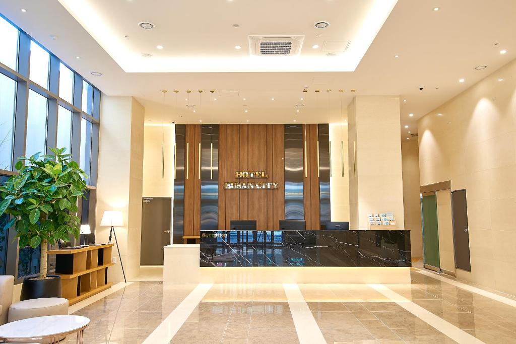 a lobby of a building with a reception desk at Busan City Hotel in Busan