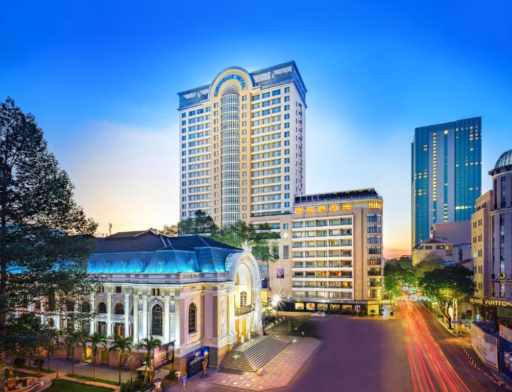 a city street with tall buildings and tall buildings at Caravelle Saigon in Ho Chi Minh City
