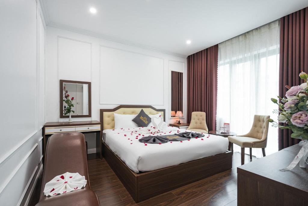 Postel nebo postele na pokoji v ubytování Wind Hotel