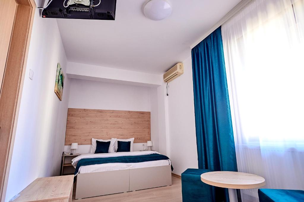 Postel nebo postele na pokoji v ubytování Hotel-Apartments Roxy&Maryo