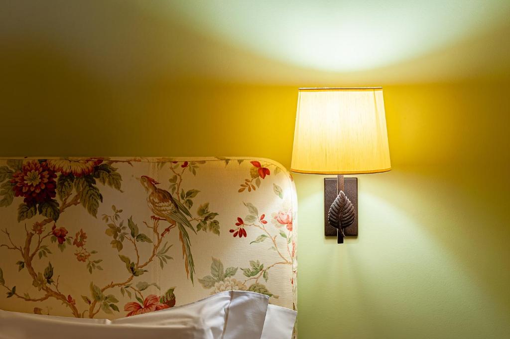 Postel nebo postele na pokoji v ubytování Al Segnavento - Fiori&Frutti
