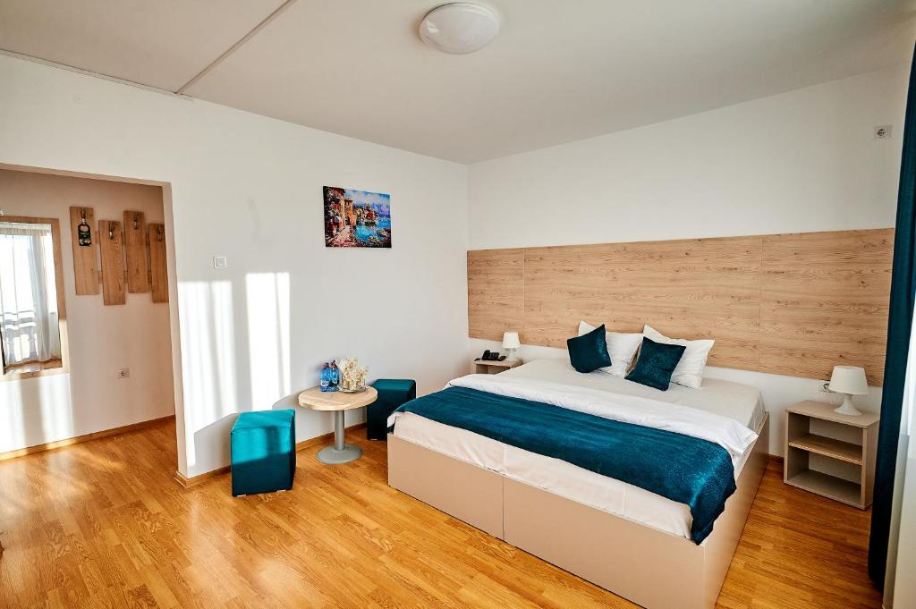 Postel nebo postele na pokoji v ubytování Hotel-Apartments Roxy&Maryo