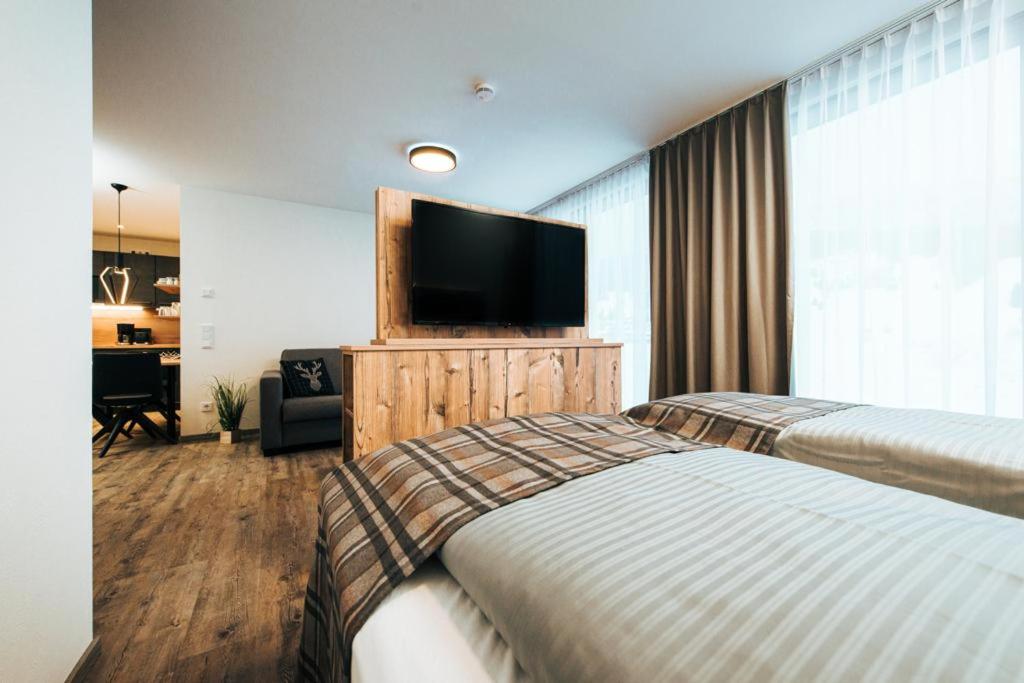 Postel nebo postele na pokoji v ubytování Living Mountain Tannheim