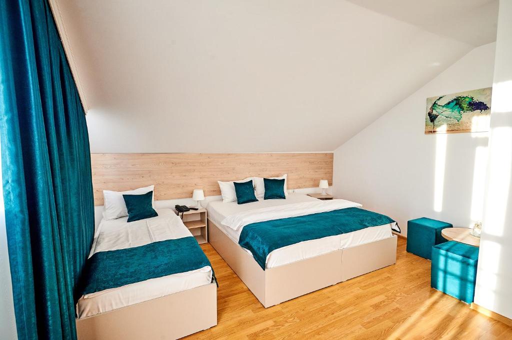 Postel nebo postele na pokoji v ubytování Hotel-Apartments Roxy&Maryo