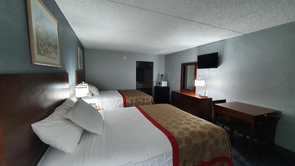 Postel nebo postele na pokoji v ubytování South Padre Island Inn