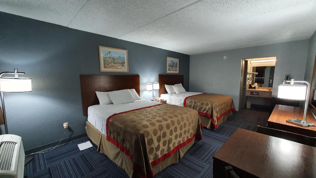 Ein Bett oder Betten in einem Zimmer der Unterkunft South Padre Island Inn