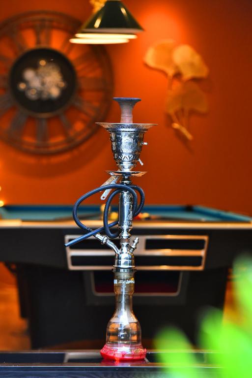 a silver candle holder on top of a table at Emirates Stars Hotel Apartments Dubai in Dubai