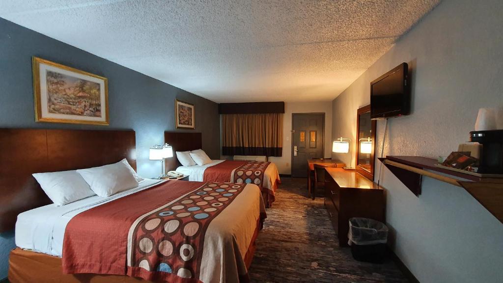 Postel nebo postele na pokoji v ubytování South Padre Island Inn