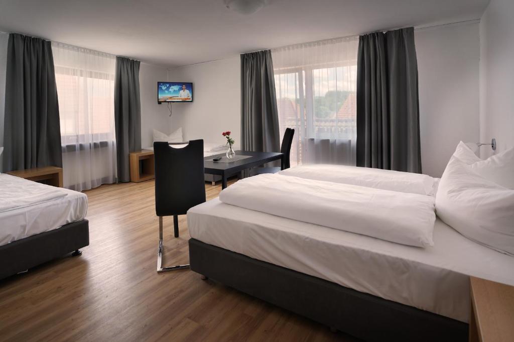 Postel nebo postele na pokoji v ubytování Hotel Gasthof Metzgerei Lamm - Benedikt Rückel