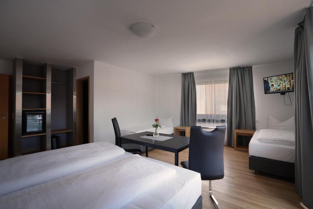 Postel nebo postele na pokoji v ubytování Hotel Gasthof Metzgerei Lamm - Benedikt Rückel