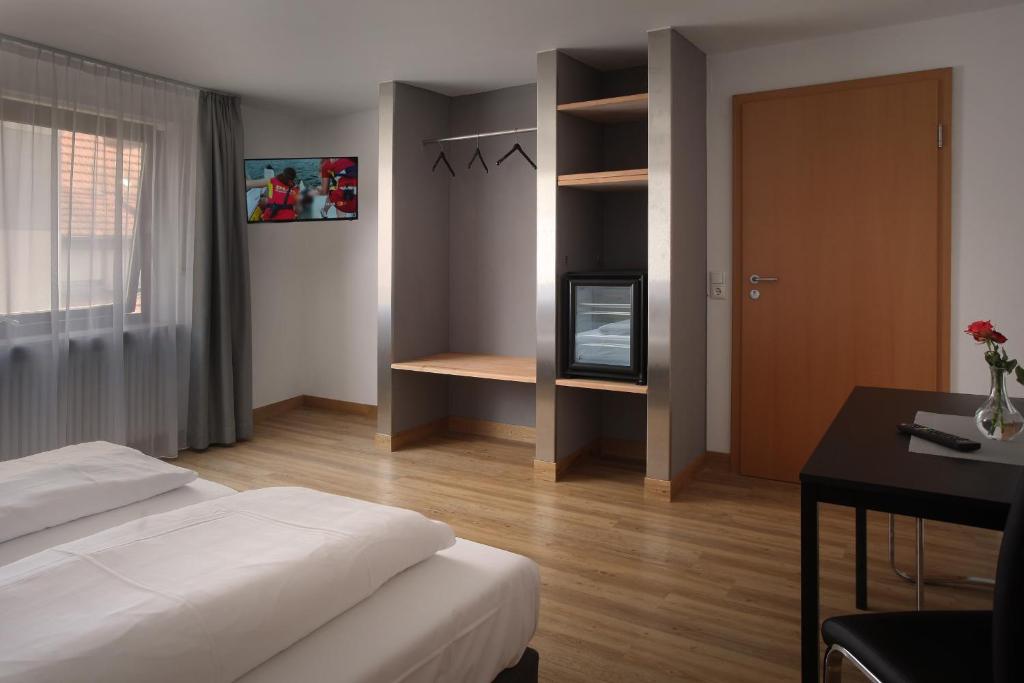Postel nebo postele na pokoji v ubytování Hotel Gasthof Metzgerei Lamm - Benedikt Rückel