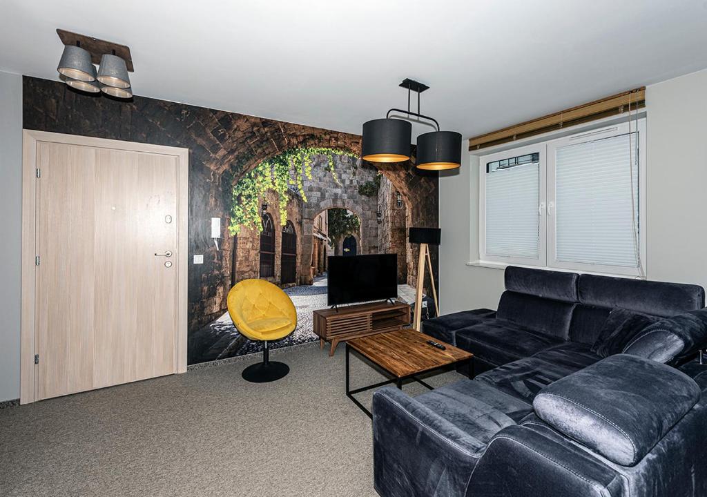 Televízia a/alebo spoločenská miestnosť v ubytovaní Apartament Piano