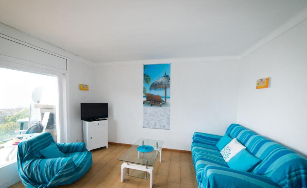 TV a/nebo společenská místnost v ubytování Appartement Vue Mer a Deux pas de la Plage