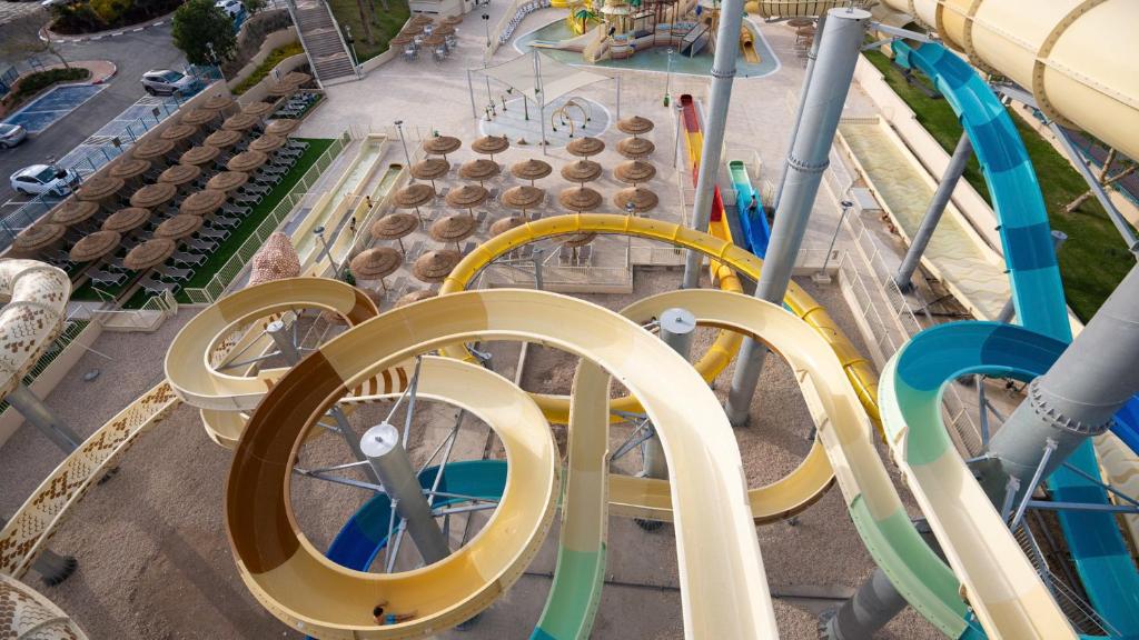 an aerial view of a water park with a roller coaster at U Splash Resort Eilat in Eilat