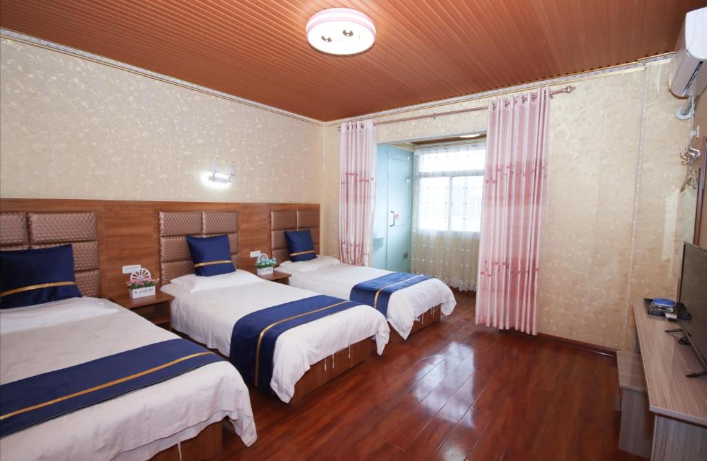 Postel nebo postele na pokoji v ubytování One Meter Sunshine Xi'an Xianyang International Airport Hotel