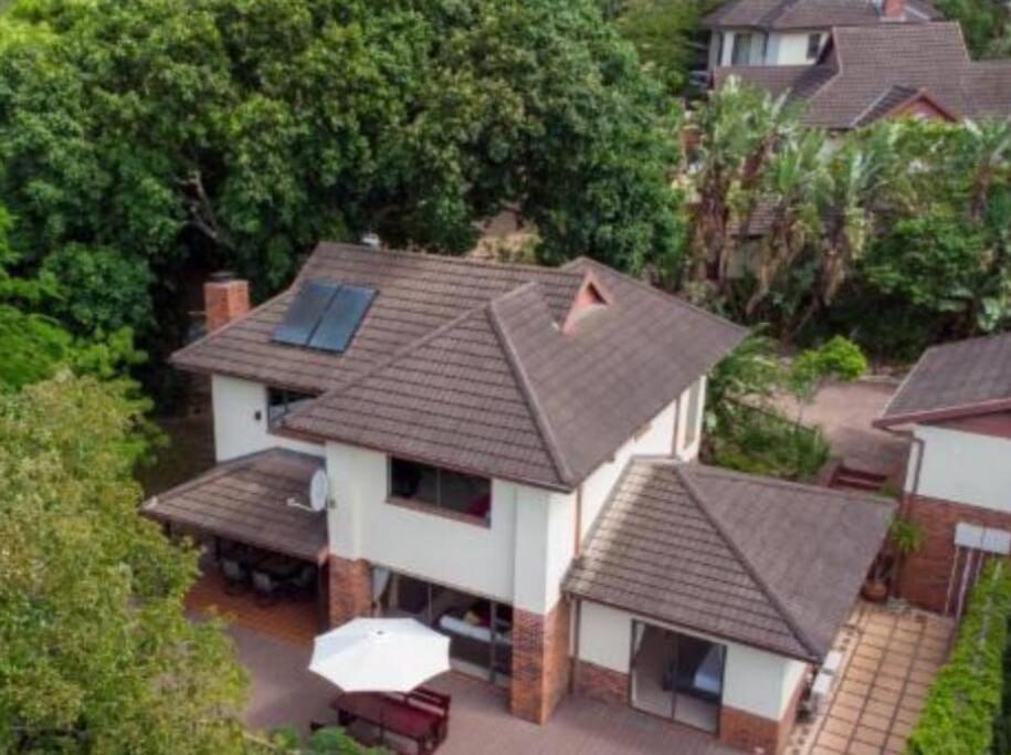 an overhead view of a house with a roof at Marula Mews T17 Villa - Selborne Golf Estate in Kelso