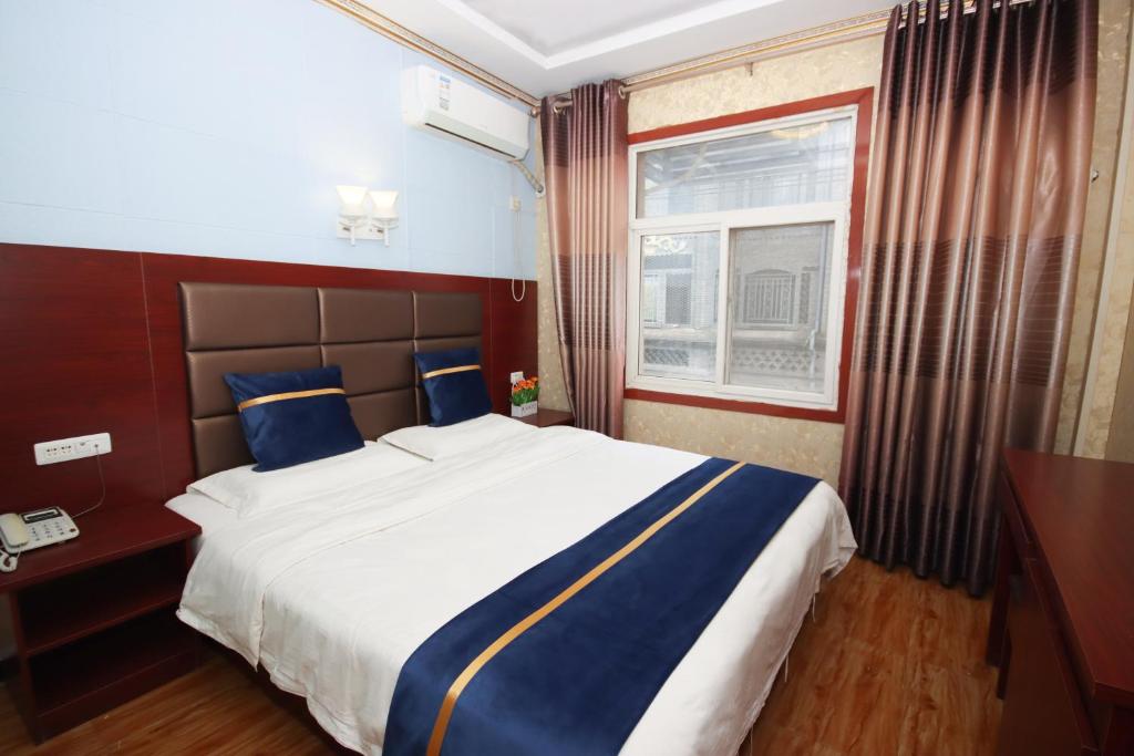 Postel nebo postele na pokoji v ubytování One Meter Sunshine Xi'an Xianyang International Airport Hotel