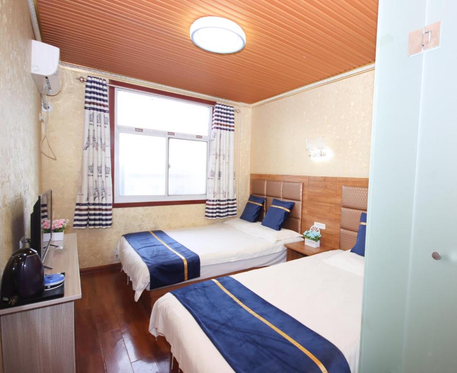 Postel nebo postele na pokoji v ubytování One Meter Sunshine Xi'an Xianyang International Airport Hotel