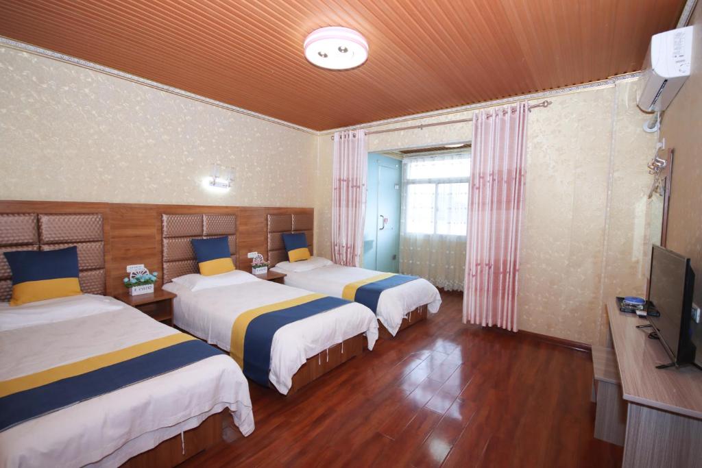 Postel nebo postele na pokoji v ubytování One Meter Sunshine Xi'an Xianyang International Airport Hotel