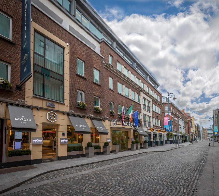 a row of brick buildings on the side of a street at The Morgan Hotel in Dublin