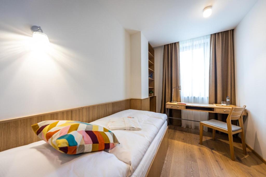 Postel nebo postele na pokoji v ubytování RAJ zdravia