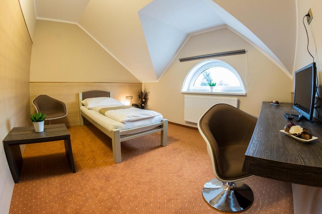 Voodi või voodid majutusasutuse Hotel Lužnice toas