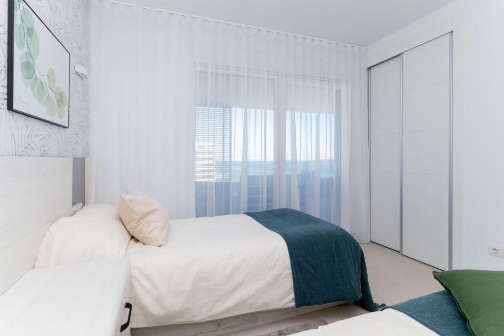 A bed or beds in a room at Espanatour PANORAMA MAR 4