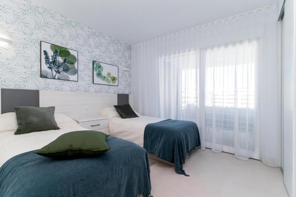 A bed or beds in a room at Espanatour PANORAMA MAR 4