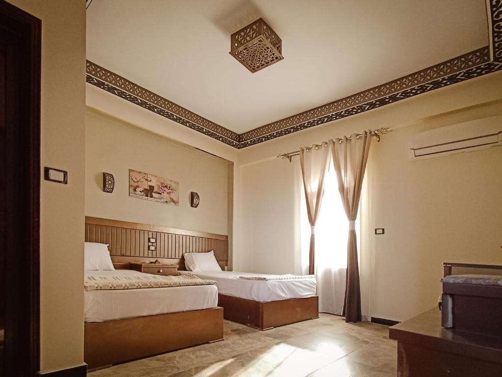 Postel nebo postele na pokoji v ubytování Shabana House