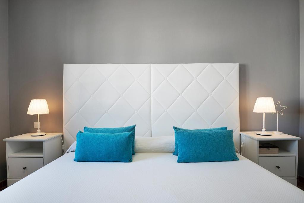 Postel nebo postele na pokoji v ubytování Apartamentos La Estrella iii