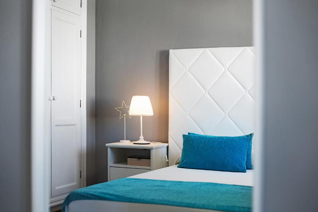 Postel nebo postele na pokoji v ubytování Apartamentos La Estrella iii